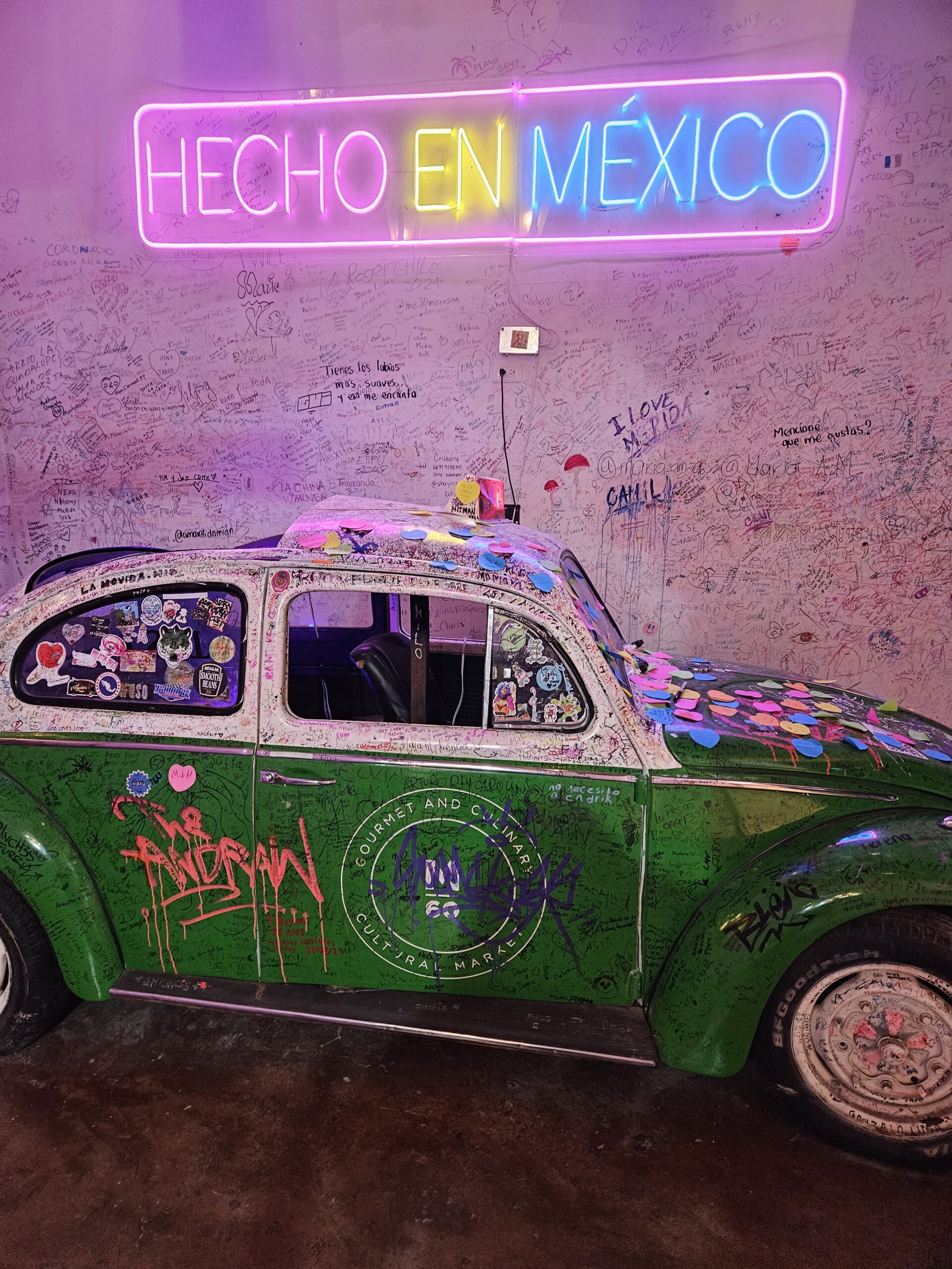 Old VW bug as part of the decoration in Market 60, a collection of restaurants, dance place and shops located in Merida Mexico which is a safe place to visit
