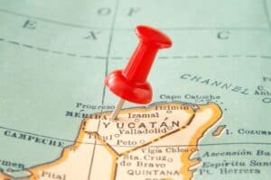 A map of the Yucatan with Merida stuck with a red tack to pinpoint its location on the map.