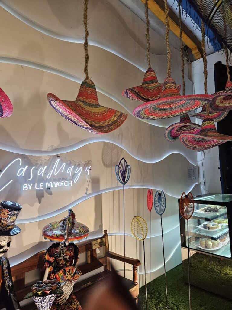 Colorful hat light fixtures inside the restaurant, Casa Maya by Le Makech, in Merida, Mexico