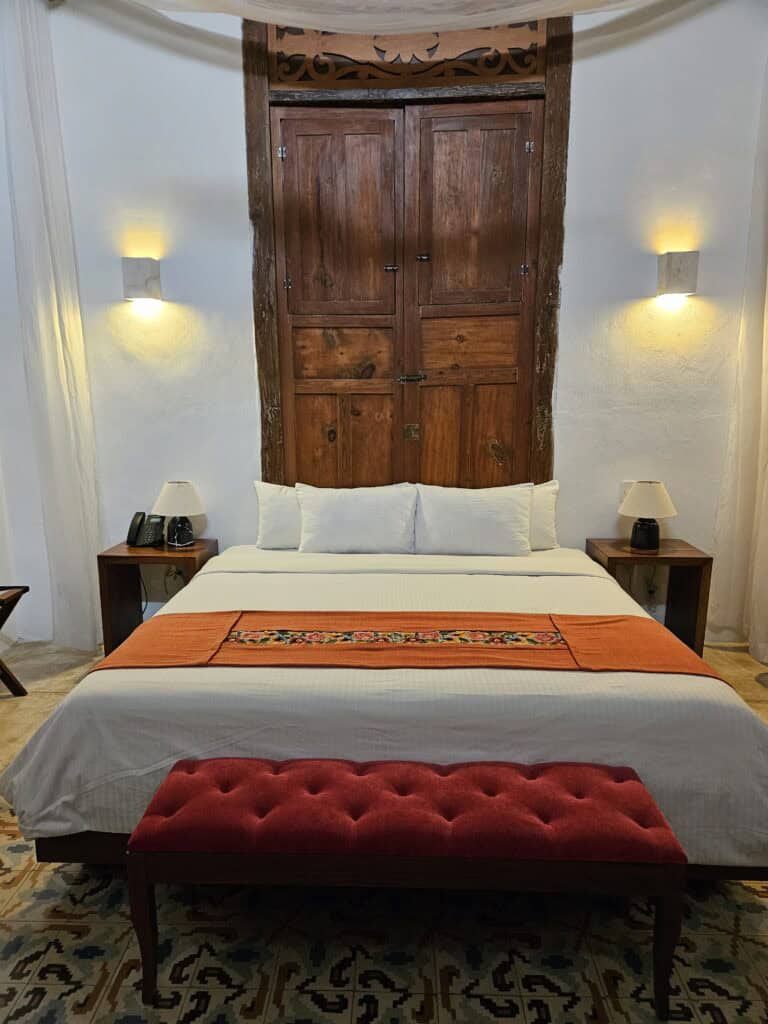 A view of the bed at the Mas Palomas Concept House in Merida Mexico
