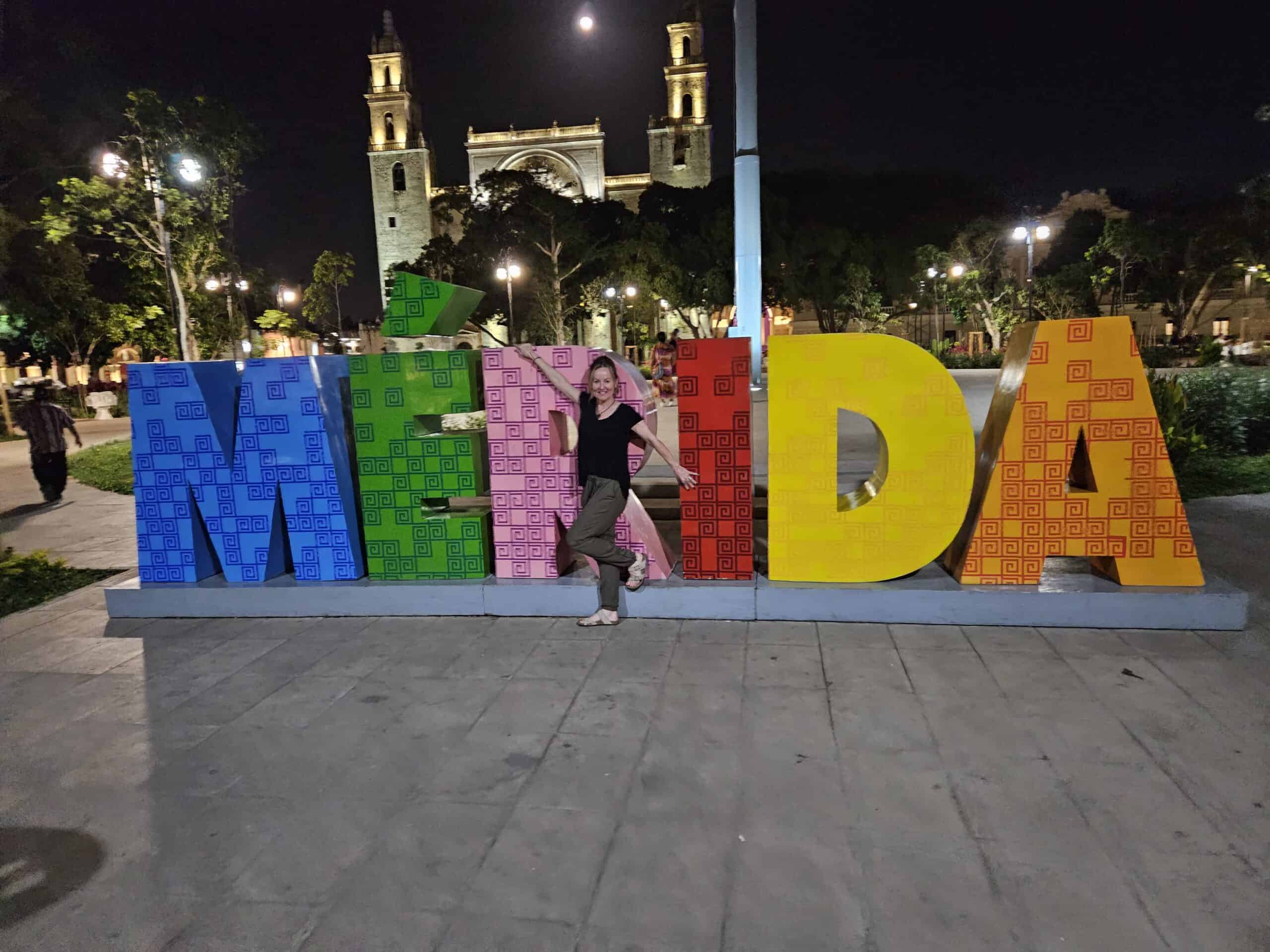 Me in front of the big color Merida sign in the main plaza.
