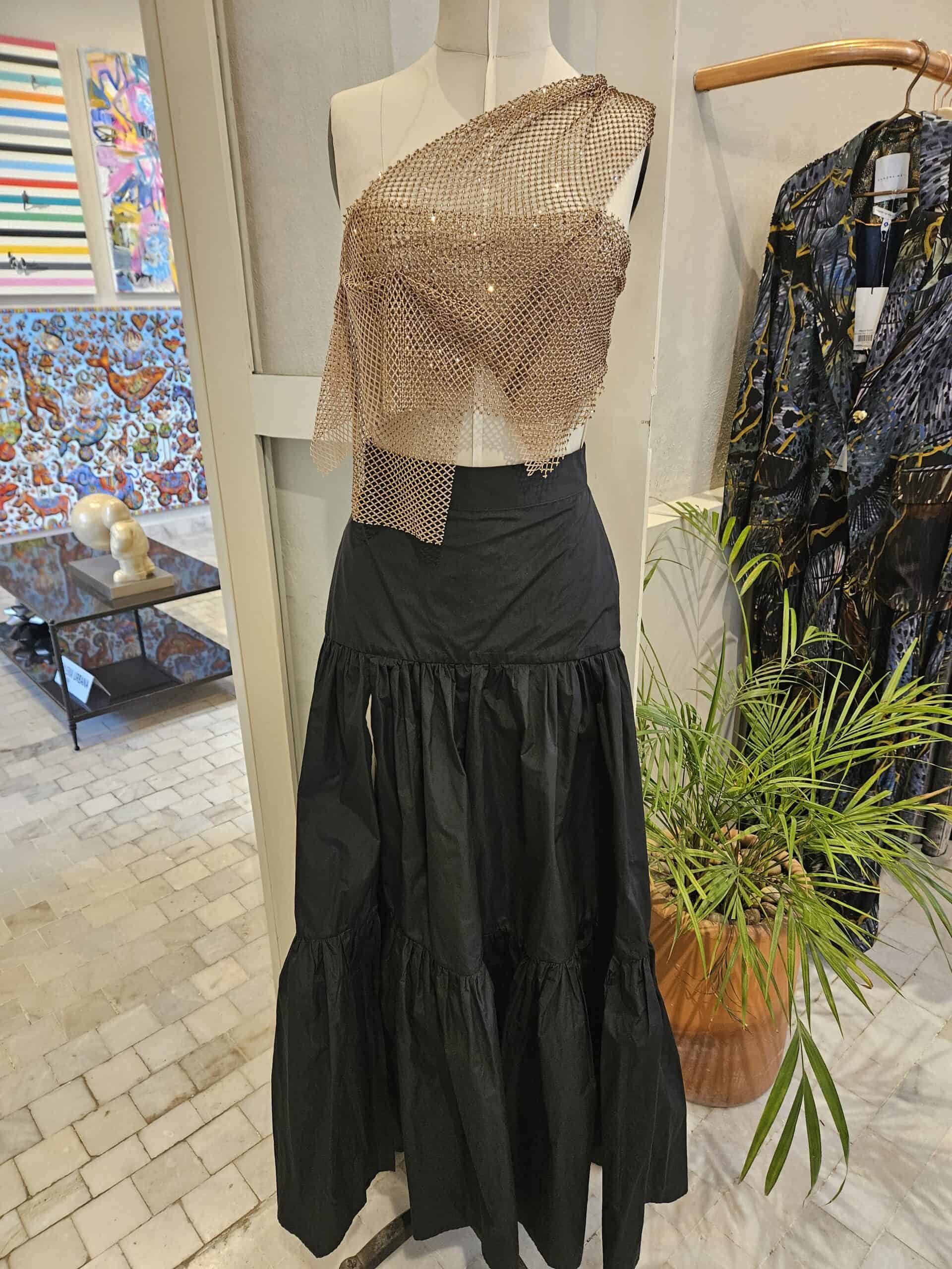 Black long skirt and gold blouse in one of the shops at Casa T'HO in Merida Mexico