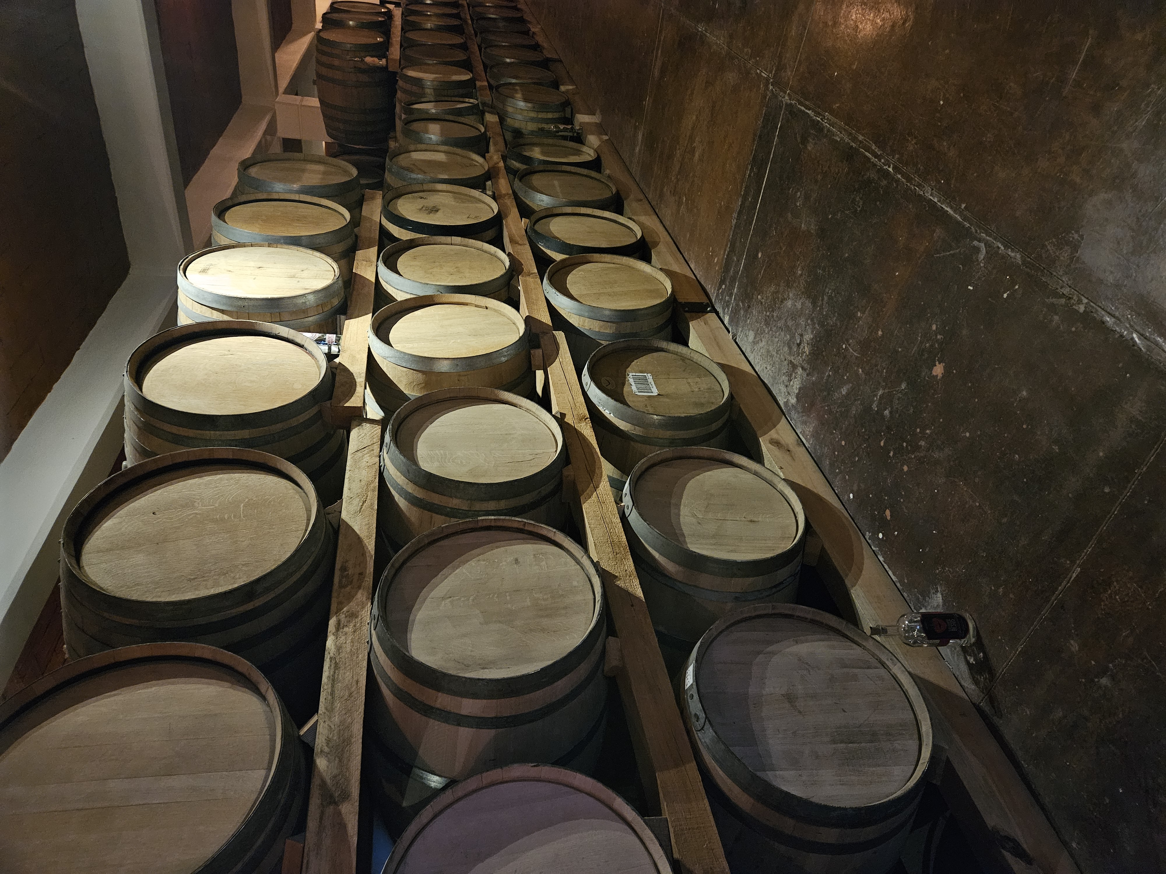 Barrels of Mezcal stacked at one of the palenques visited during a tour in Oaxaca Mexico