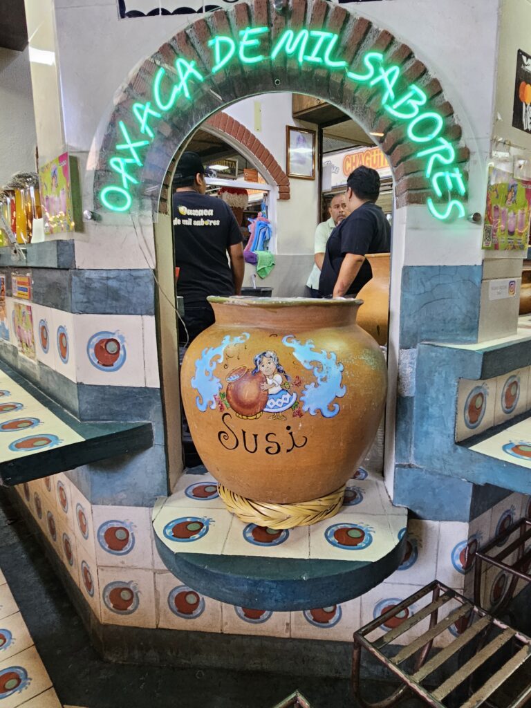 Vendor in one of the stalls in a market in Oaxaca Mexico