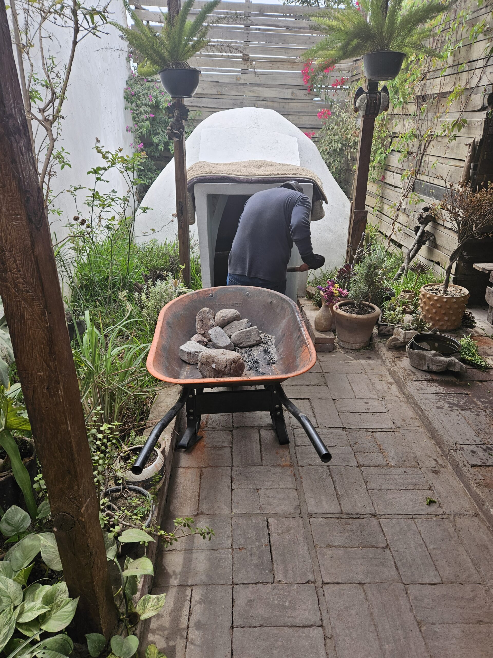 Coals being loaded into the sweat lodge as part of the temazcal ceremony in Oaxaca Mexico