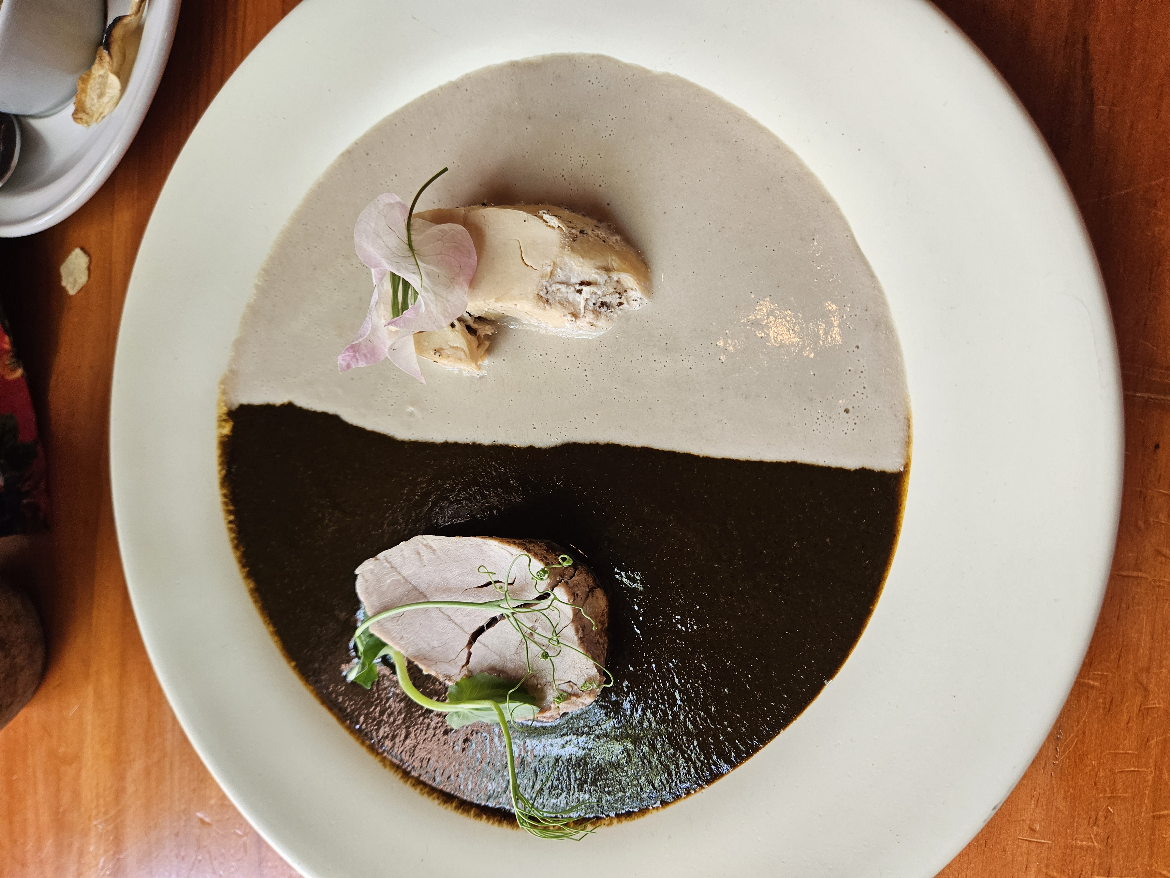 Mole dish with dark and light mole with chicken at a restaurant in Oaxaca Mexico
