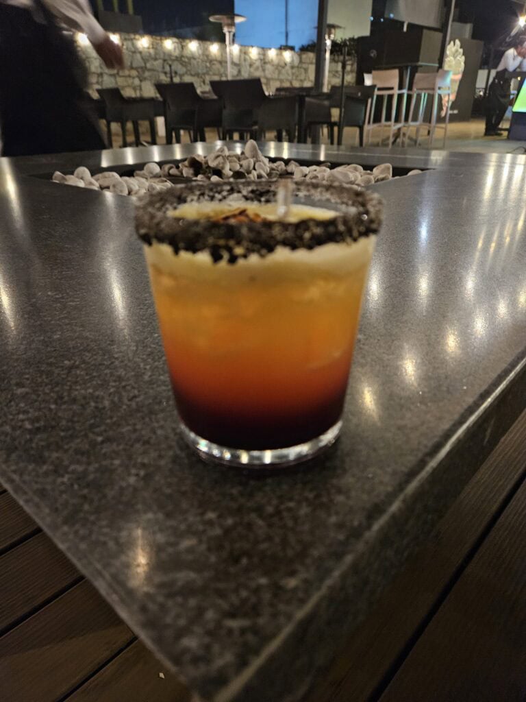 A mezcal cocktail with a tajin rim at Mi Cielo rooftop bar in Oaxaca Mexico