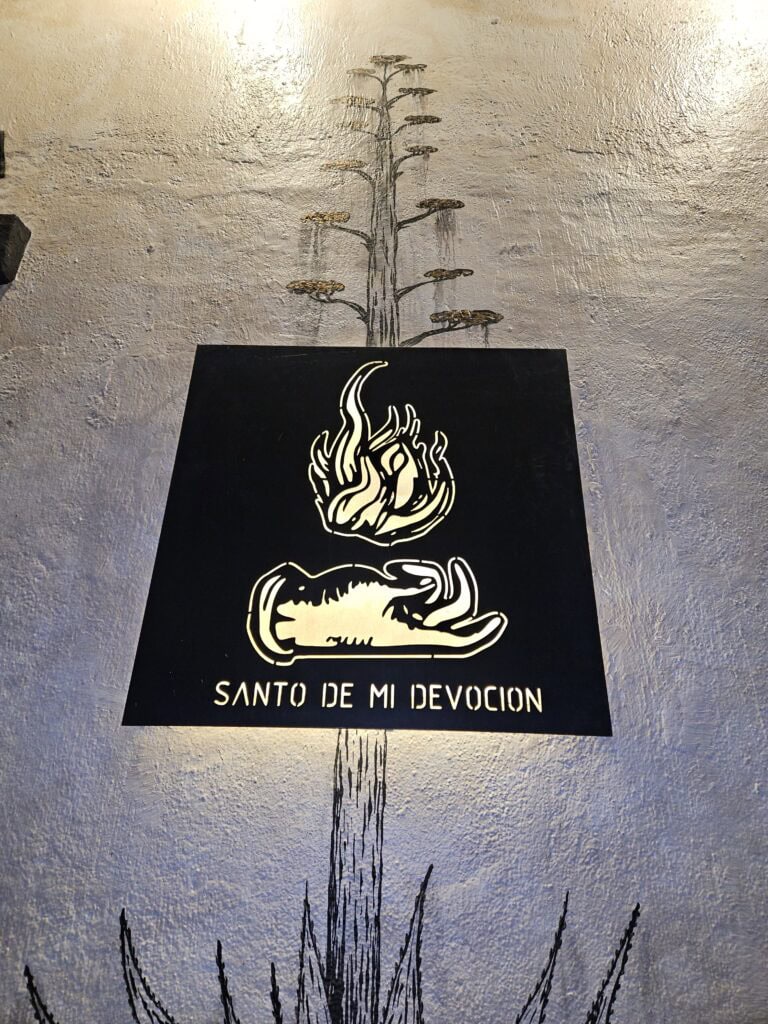 Signate outside of Santo de Mi Devoción Mezcalería in Oaxaca Mexico