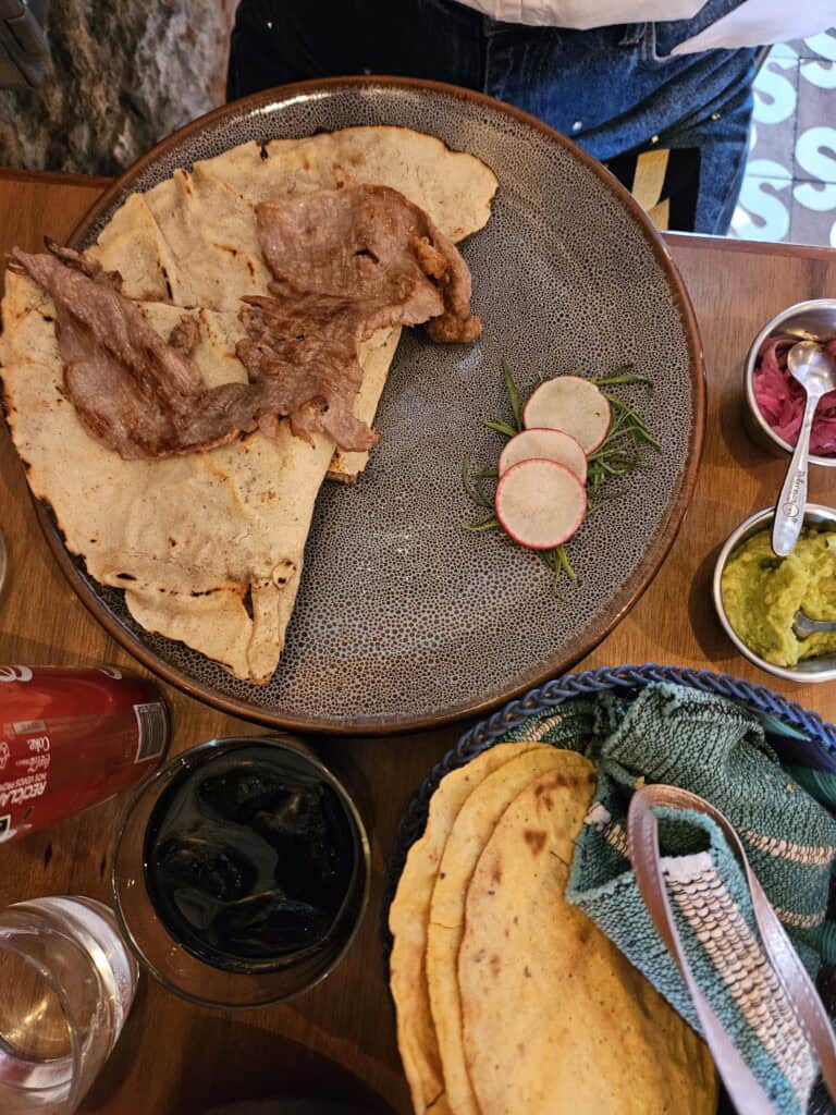 Meat and tortilla dish at Sabina Sabe in Oaxaca Mexico