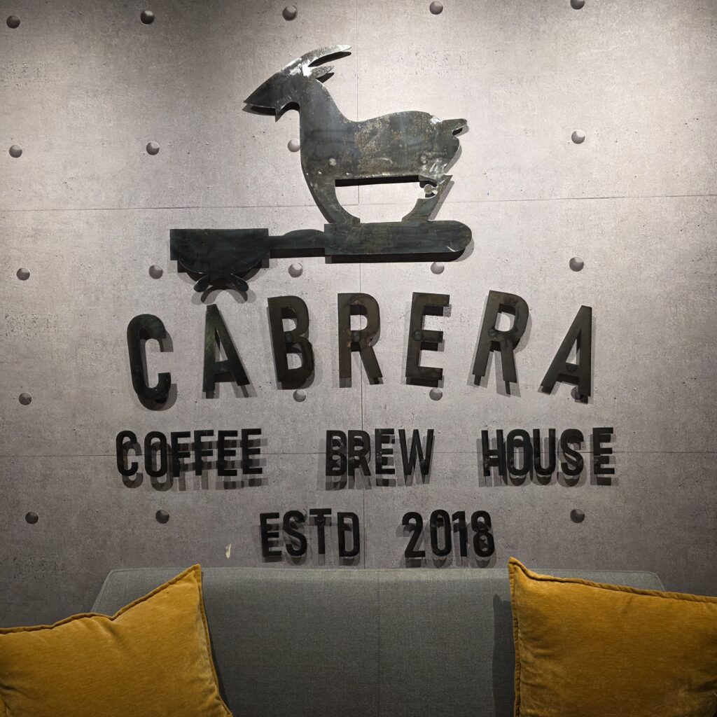 Cabrera sign in their coffee cafe with a logo of a goat, Panama City, Panama