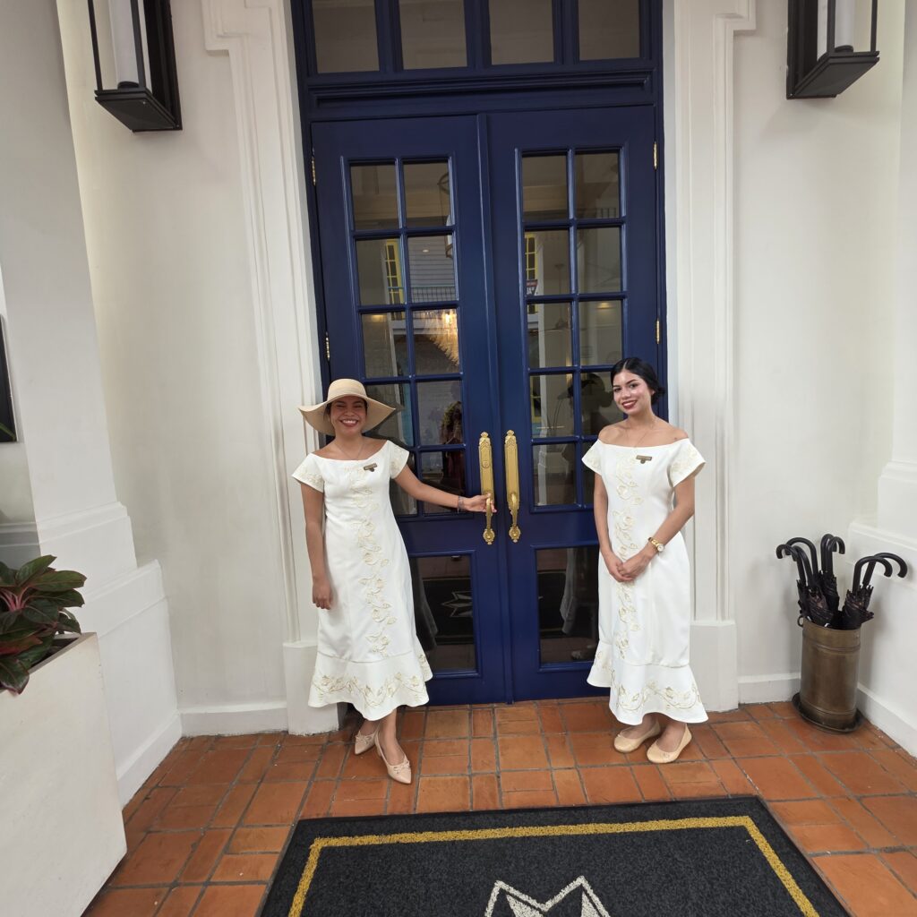 Two beautiful young ladies in white greeting customers into Sofitel Hotel in Casco Viejo Panama