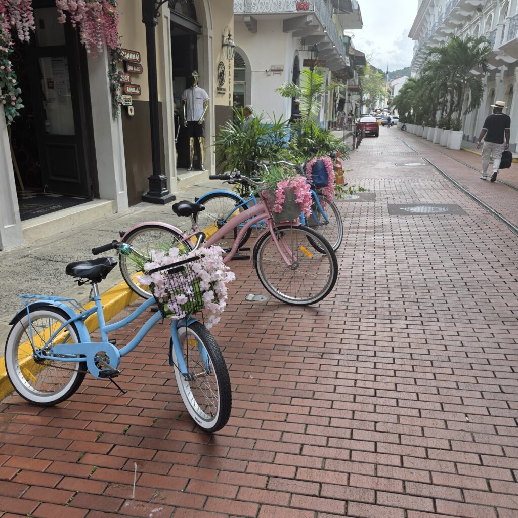 Brick street view with colorful bikes deorated with flowers in the basket in Casco Viejo neighborhood of Panama City